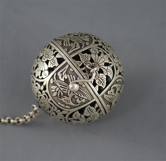 A white metal incense buner